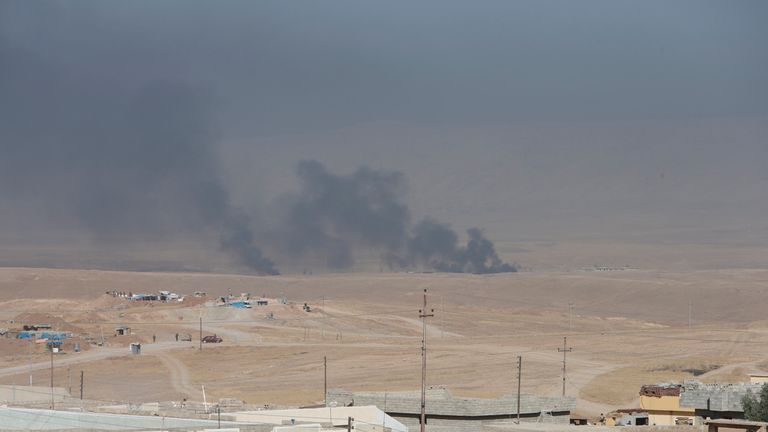 Smoke rises from clashes in the east of Mosul