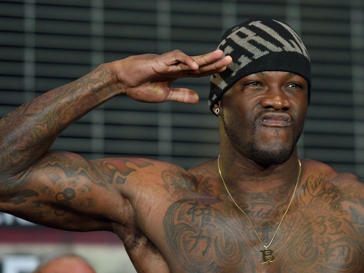 Boxer Deontay Wilder of the US flexes his muscles while weighing in at Barclay's Center January 15, 2016 in New York. Wilder is scheduled to fight Artur S