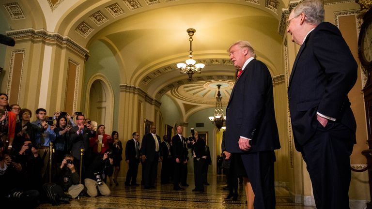 Mr Trump speaks to the media after a meeting with Senate Majority Leader