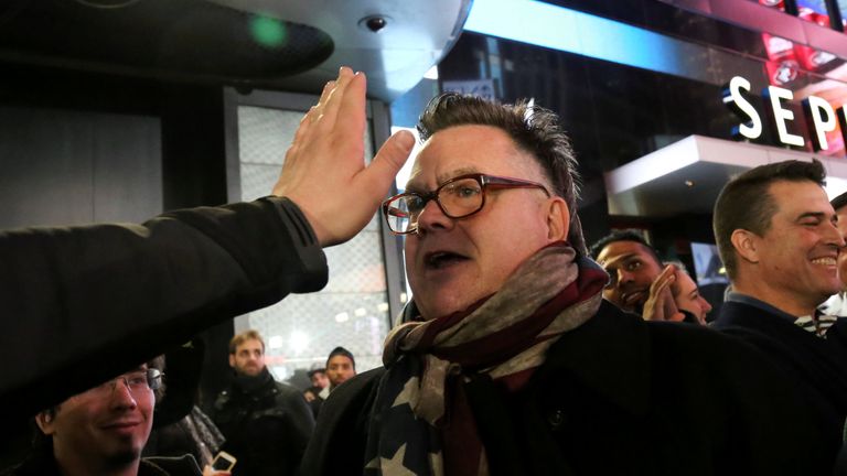 A supporter of U.S. President-elect Donald Trump argues with a man against Trump in Times Square, New York