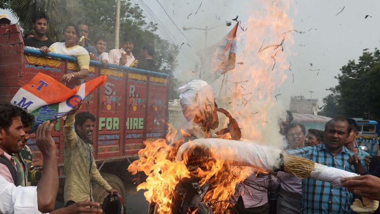 Indian activists from the Trinamool Congress (TMC) political party burn an effigy of Prime Minster Narendra Modi during a rally as part of a nationwide protest against demonetisation in Kolkata on November 28, 2016. Tens of thousands of people turned out November 28 for nationwide protests against India&#39;s controversial ban on high-value banknotes, which opposition party organisers say has caused a &#39;financial emergency&#39;