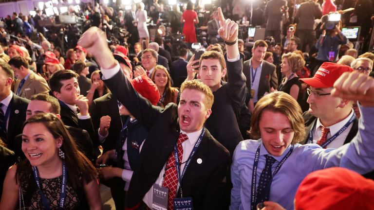 People cheer as voting results for Florida come in at Donald Trump&#39;s election night event at the New York Hilton Midtown