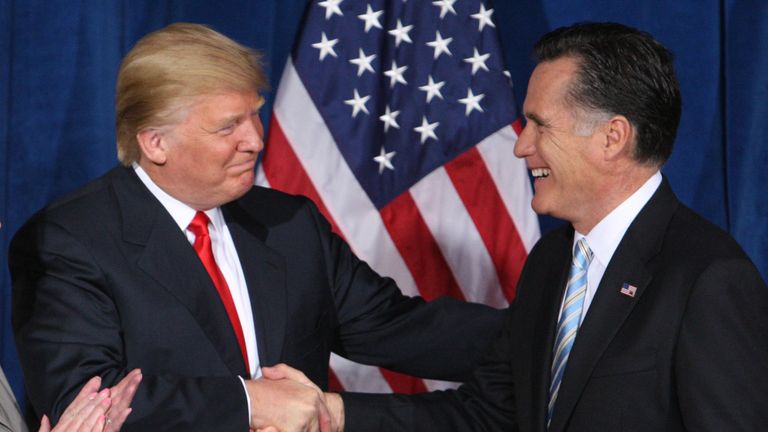 Businessman and real estate developer Donald Trump (L) greets U.S. Republican presidential candidate and former Massachusetts Governor Mitt Romney after endorsing his candidacy for president at the Trump Hotel in Las Vegas, Nevada February 2, 2012. REUTERS/Steve Marcus/File Photo
