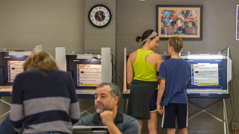 TALLAHASSEE, FL - NOVEMBER 08: Margo Layerd and her 13 year-old son Jonah talk as she votes at the Lafayette Park precinct on November 8, 2016 in Tallahassee, Florida, United States. Americans across the nation are picking their choice for the next president of the United States. (Photo by Mark Wallheiser/Getty Images)