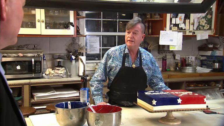Baker Michael Baugh with the cake he created