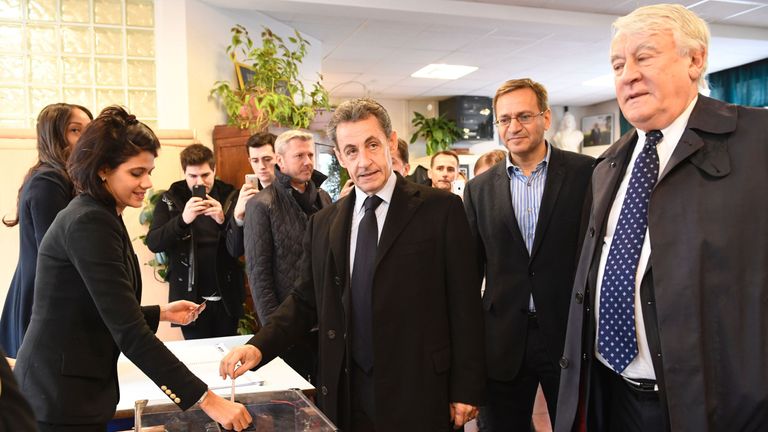 Former French president Nicolas Sarkozy casts his vote in Paris