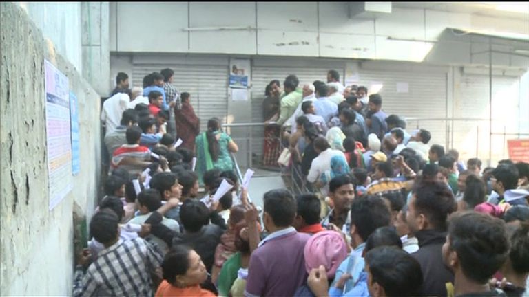 Hundreds queue outside the State Bank of India in New Delhi