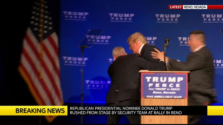 Donald Trump is rushed off the stage by security agents at a rally in Reno