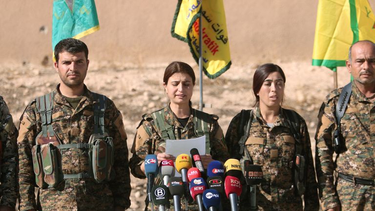 Syrian Democratic Forces (SDF) commanders attend a news conference in Ain Issa, Raqqa Governorate