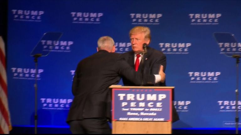 Donald Trump is rushed off stage in Reno, Nevada, after a false gun scare