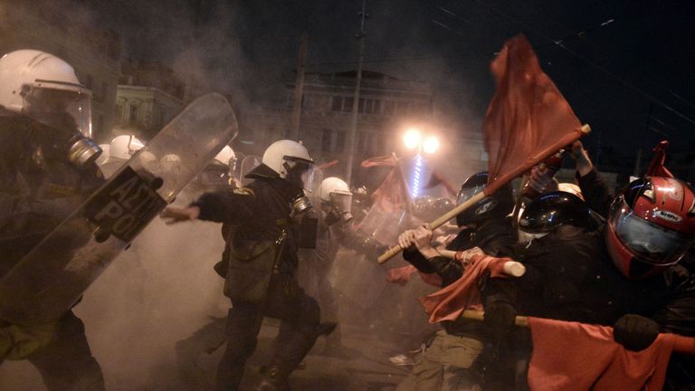Greek riot police clash with demonstrators in Athens