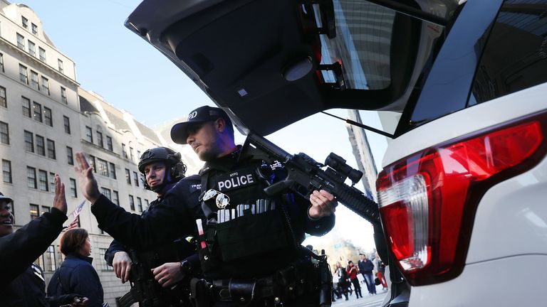 NEW YORK, NY - NOVEMBER 08: Counterterrorism police patrol near Trump Tower on Election Day on November 8, 2016 in New York City. Throughout the country, millions of Americans are casting their votes today for either Hillary Clinton or Donald Trump to become the 45th president of the United States. (Photo by Spencer Platt/Getty Images)