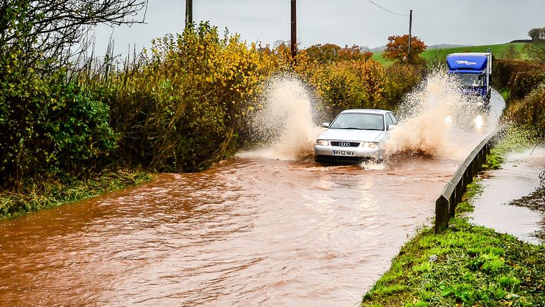 Cars creep through flood water on the main A396 between Tiverton and Exeter near, Upexe, as it runs off fields and collects on the main carriageway, as Storm Angus continues to sweep across the UK.
Picture date: Monday November 21, 2016
