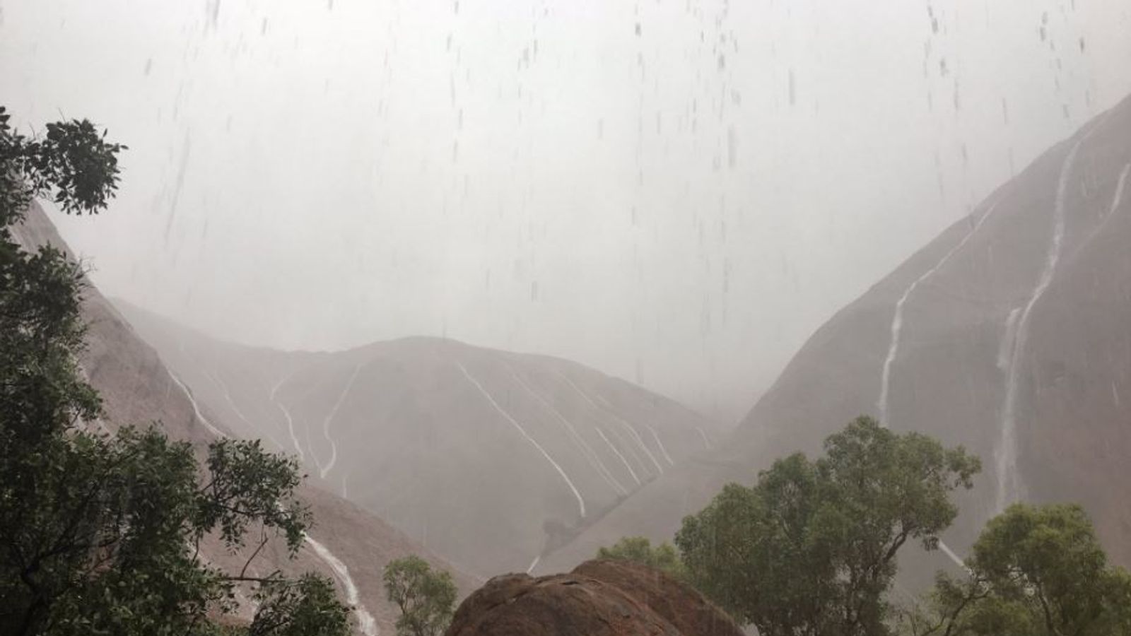 Uluru Storm Stunning waterfalls on Uluru after freak storm hits the Australian rock ...