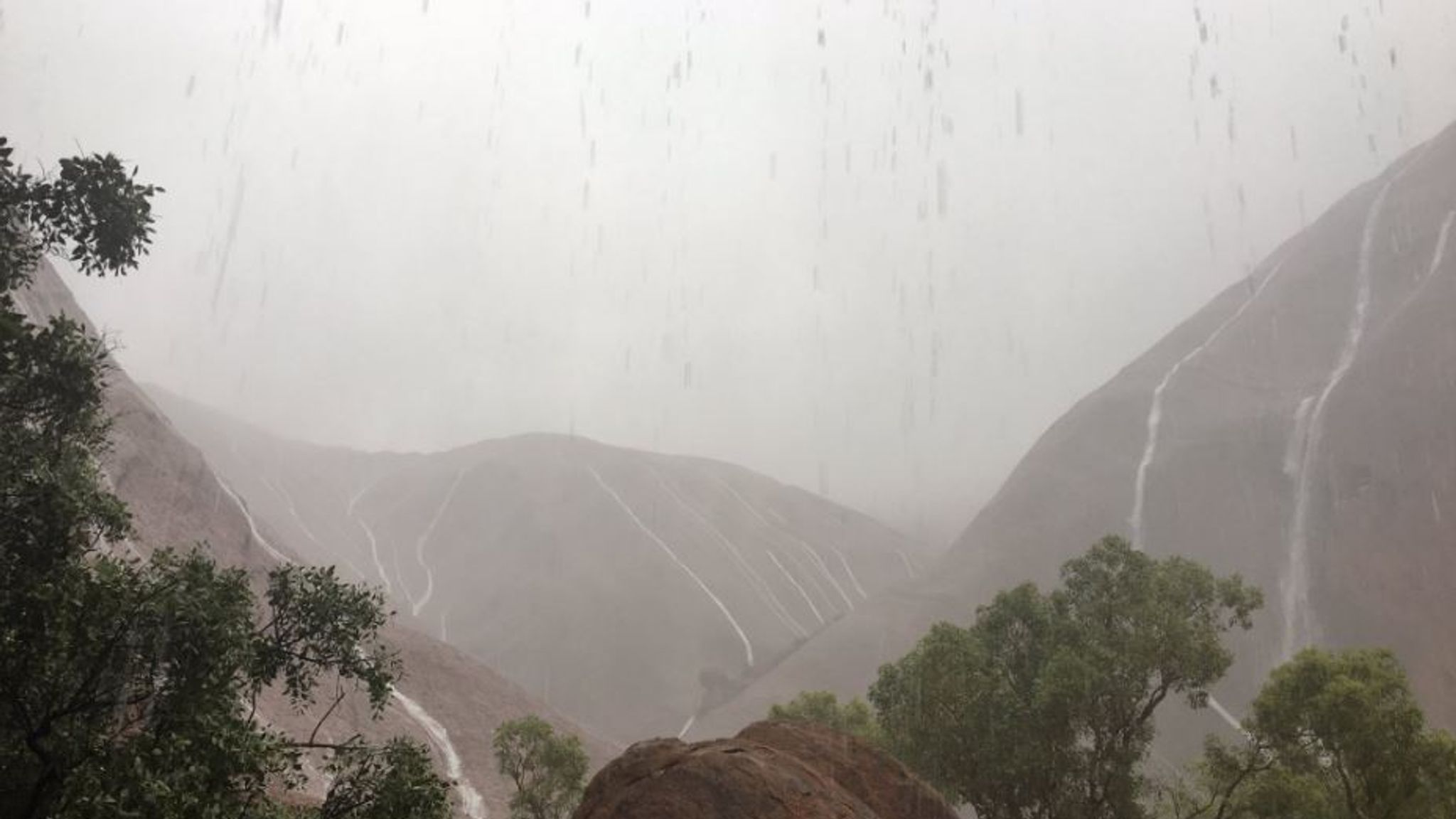 Uluru Storm Stunning waterfalls on Uluru after freak storm hits the Australian rock ...