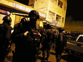 Officers from the Jordanian anti- terrorism unit of the Special Operations Forces prepare to go into the Crusader Castle on December 18, 2016 in Al-Karak, Jordan. A Canadian tourist is believed to be among seven people killed during a shootout between police and gunmen in Jordan. Several other tourists were taken hostage by the gunmen in Karak Castle but have now been released