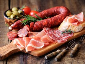 Up to four portions a week of cured or processed meat is considered high