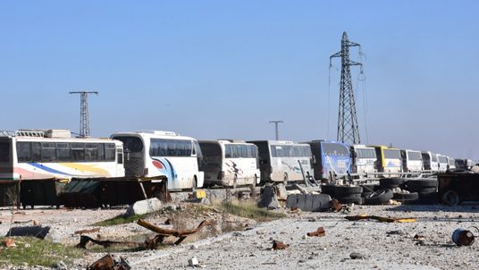 Empty buses head to Aleppo to pick up the final civilians to be evacuated