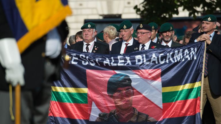 People attend a Justice for Marine rally in Parliament Square, London, in October in support of Sergeant Alexander Blackman, who was handed a life sentence three years ago after he killed a wounded captive at close range with a 9mm pistol in Helmand province during September 2011