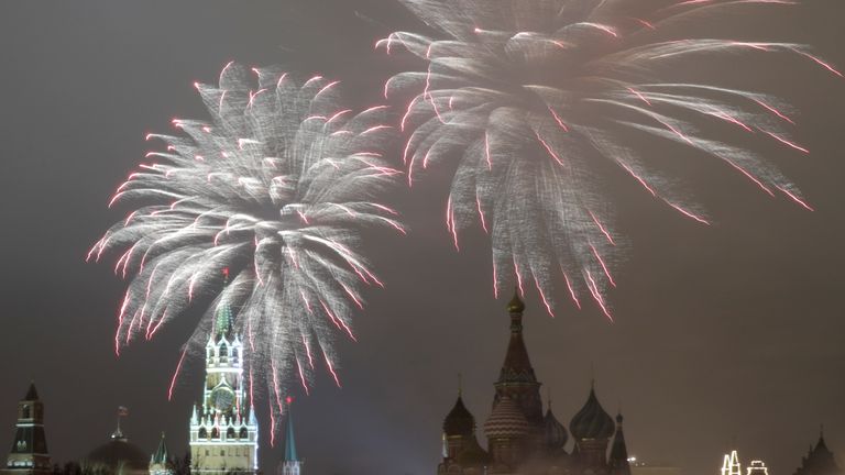 Fireworks light the sky over the Kremlin and St Basil&#39;s Cathedral in Moscow