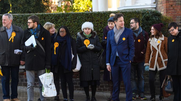Liberal Democrat prospective parliamentary candidate, Sarah Olney (C) and former Party leader Nick Clegg (C-R) canvass ahead of the Richmond Park and North Kingston by-election on November 30, 2016 in London, England. The by-election is to take place on December 1 and was triggered by the resignation of Conservative MP Zac Goldsmith in protest at the Government&#39;s proposal for a third runway at nearby Heathrow Airport