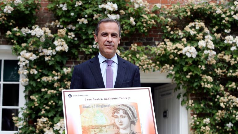 File picture of Bank of England governor Mark Carney holding the concept design for a £10note