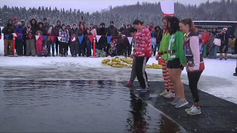 Alaskans jump into frozen water to raise funds for athletes | Offbeat ...