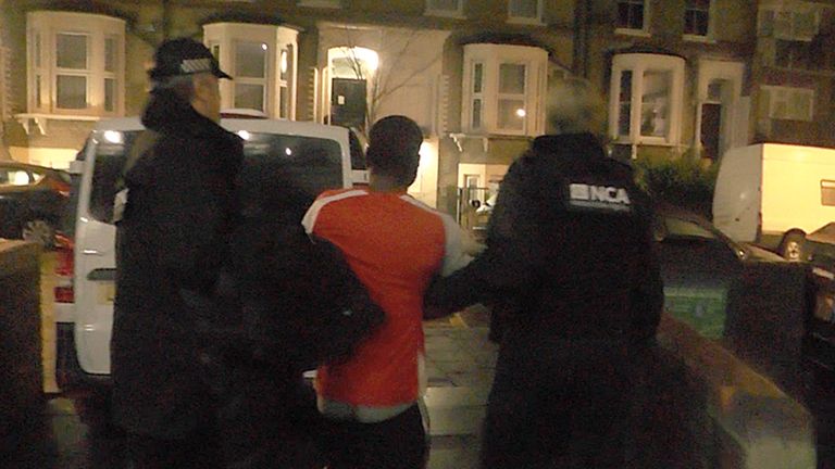 A man is arrested following a raid at a property in Stoke Newington, north-west London