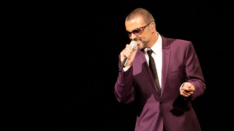 George Michael performs on stage in 2012
