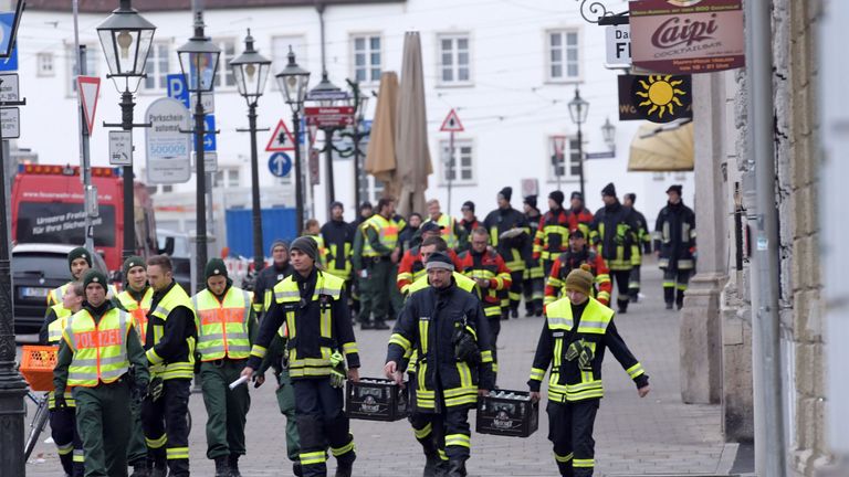 Police and paramedics help evacuate residents in Augsburg