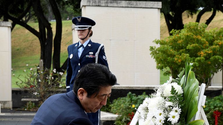 Japan PM Shinzo Abe lays wreaths in Hawaii ahead of Pearl Harbor visit ...