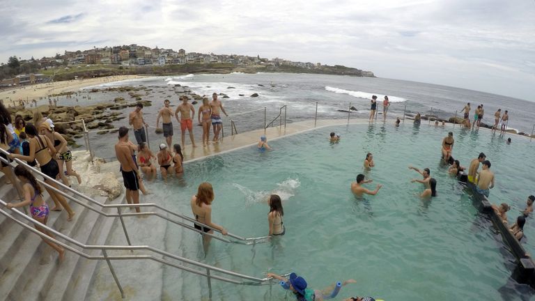 Swimmers cool off in a salt water ocean pool at Sydney&#39;s beachside suburb of Bronte
