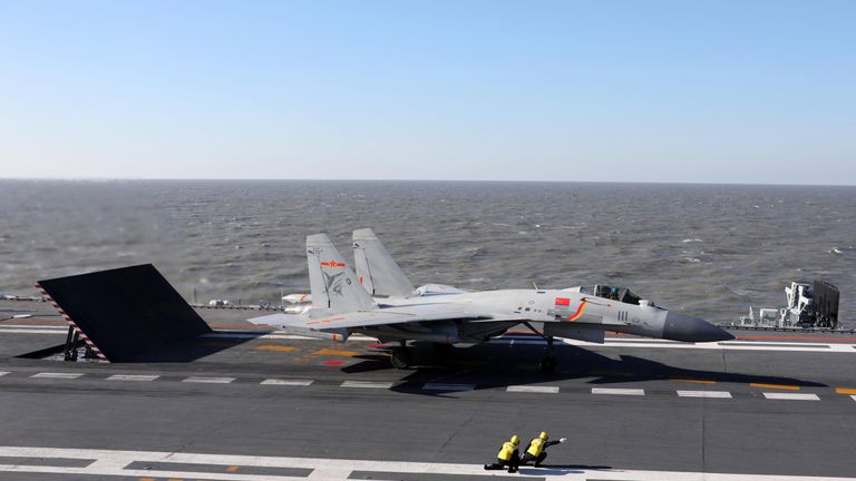 A Chinese J-15 fighter jet preparing to take off during military drills in the Bohai Sea