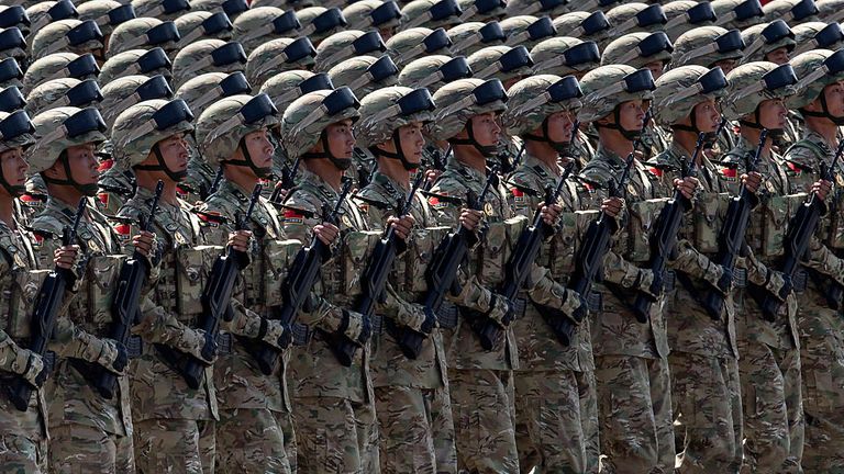 Soldiers march during a military parade in Beijing in September 2015