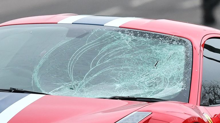 The car's windscreen was shattered on one side