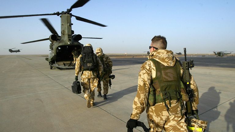 British soldiers board a transport helicopter in the southern Iraqi city of Basra 29 January 2005