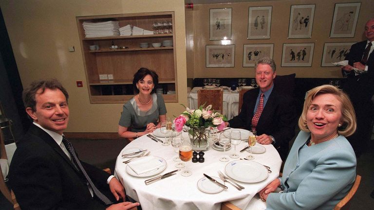 Tony and Cherie Blair sit down to dinner with Bill and Hillary Clinton at a restaurant in London, 1997