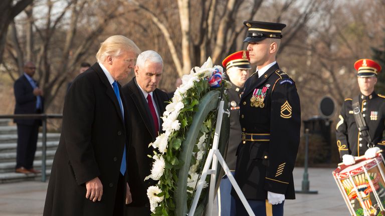 US President-elect Donald J. Trump and US Vice President-elect Mike Pence participate in a wreath laying ceremony at Arlington National Cemetery on January 19, 2017 in Arlington, Virginia