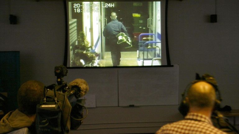 Police show the media CCTV footage from the Northern Bank robbery in January 2005