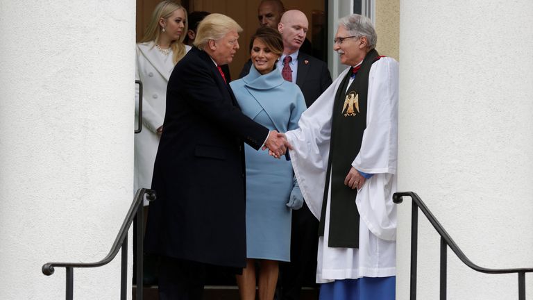 The Trumps greet Reverend Luis Leon at St. John's Church