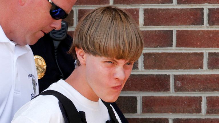Police lead suspected shooter Dylann Roof, 21, into the courthouse in Shelby, North Carolina, June 18, 2015