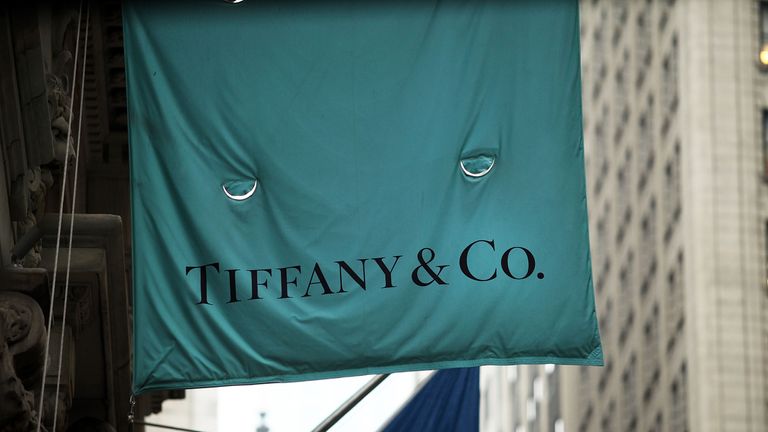 A flag for a Tiffany & Co store hangs along Wall Street