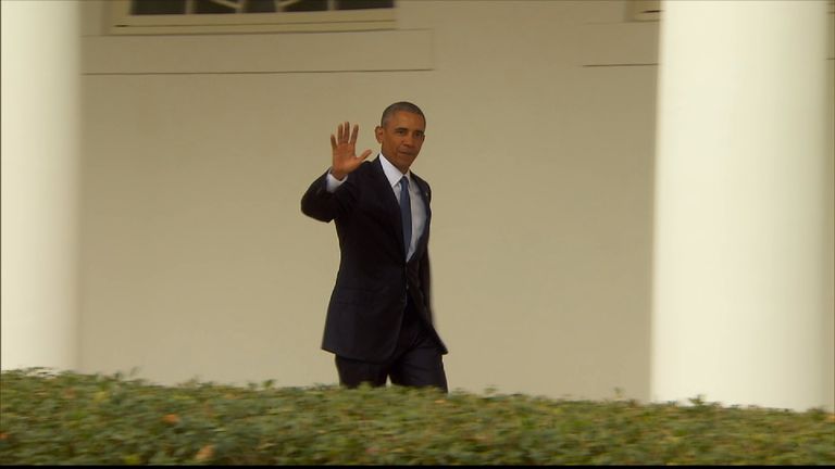 Barack Obama waves to the media at the White House