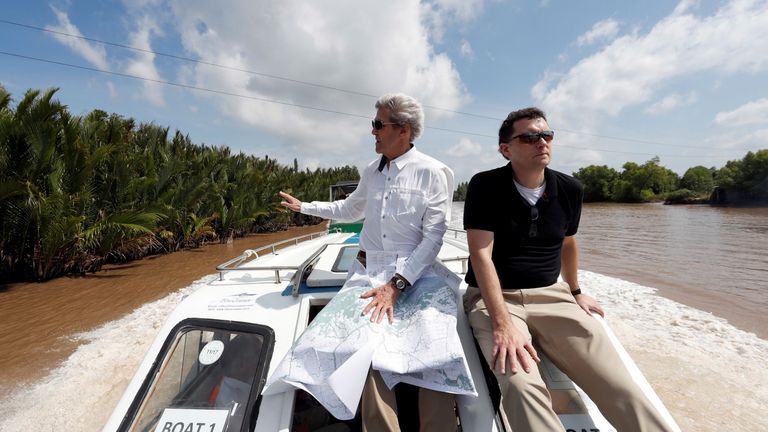 John Kerry looks for the spot where 48 years ago he was shot dead a Viet Cong soldier