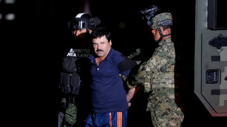 Soldiers parading Joaquin Guzman in front of photographers last August