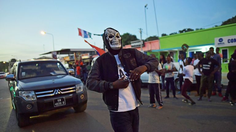 People celebrate in the streets after hearing of the confirmed departure of former Gambian leader Yahya Jammeh in Banjul on January 21, 2017. Yahya Jammeh, The Gambia&#39;s leader for 22 years, flew out of the country on January 21, 2017 after declaring he would step down and hand power to President Adama Barrow, ending a political crisis. An AFP journalist at the airport saw Jammeh board an unmarked plane heading for an unspecified destination, seen off by a delegation of dignitaries and soldiers. 