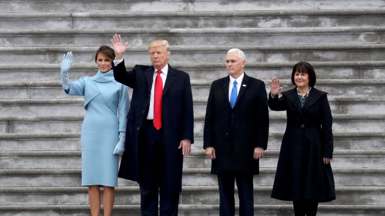 First Lady Melania Trump, President Donald Trump, Vice President Mike Pence and Karen Pence wave goodbye to the Obamas