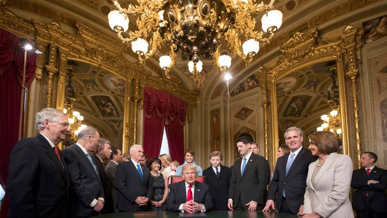 The President is joined by the Congressional leadership and his family as he formally signs his cabinet nominations into law, in the President's Room of the Senate