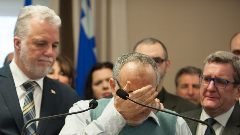 Khaled El Kacemi of the Islamic Cultural Center of Quebec breaks down during a news conference