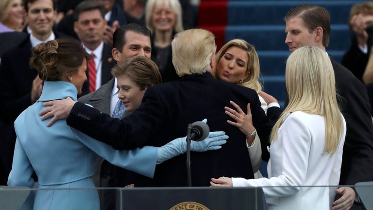 U.S. President Donald Trump embraces relatives during inauguration ceremonies at the Capitol in Washington